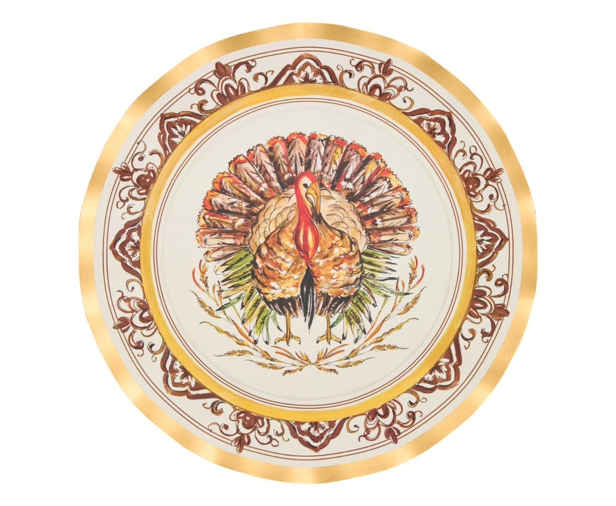 Wavy-edge disposable dinner plate with gold foil rim and central turkey illustration on paper.