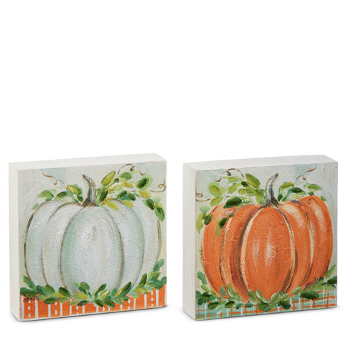 Wooden block shaped like a harvest pumpkin patch with orange and green autumn foliage accents.