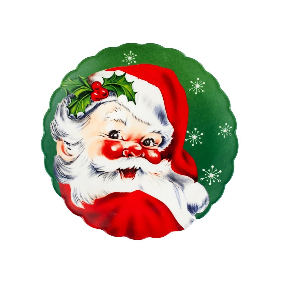 8-inch vintage ceramic dessert plate with scalloped edges featuring a green background and Santa Claus Christmas design.