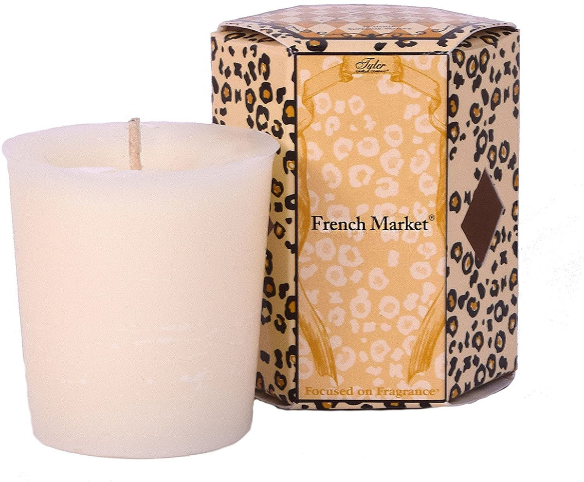 Single white votive candle in a clear glass holder