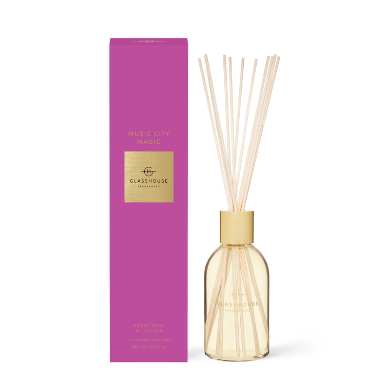 8.4 fl oz Music City Magic diffuser with amber violet peony rose leather scent in a clear bottle.