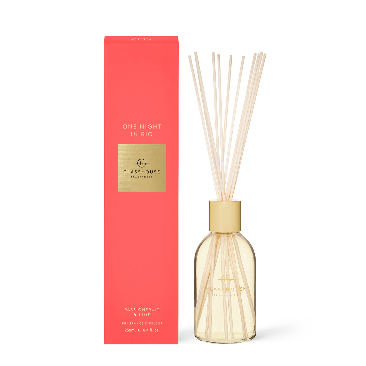 Glasshouse One Night in Rio diffuser with glass bottle containing pale yellow liquid and wooden reeds.