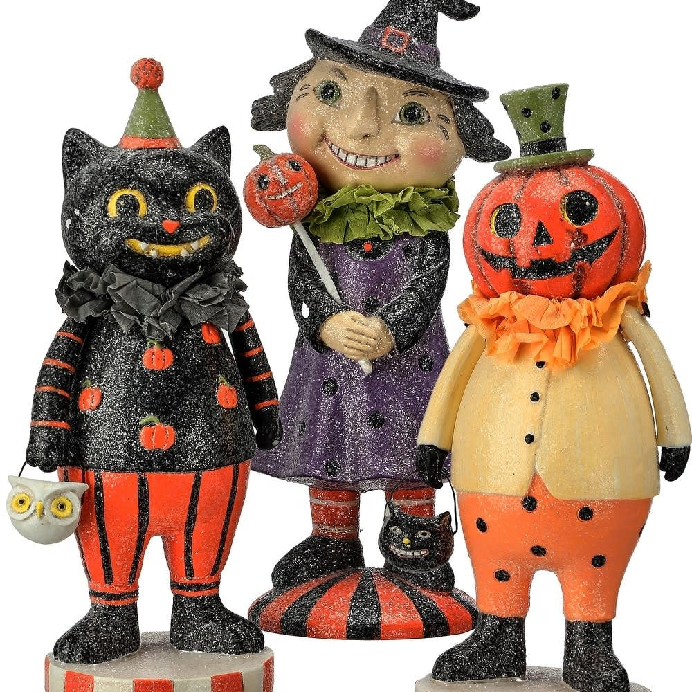 Hand-painted resin figurine with sugared finish depicting a retro Halloween child silhouette.