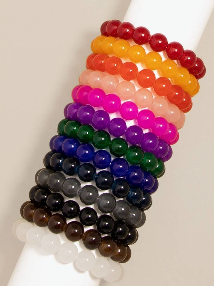 Stretch bracelet with glossy lucite glass beads in a single-color round pattern.