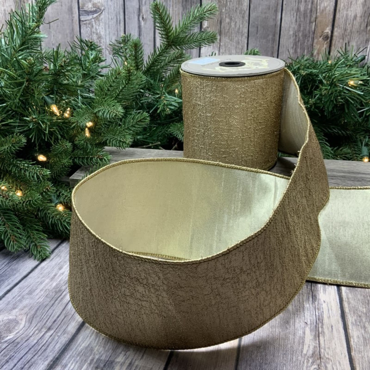 4-inch by 10-yard gold metallic fabric roll with an aurora shimmer pattern.