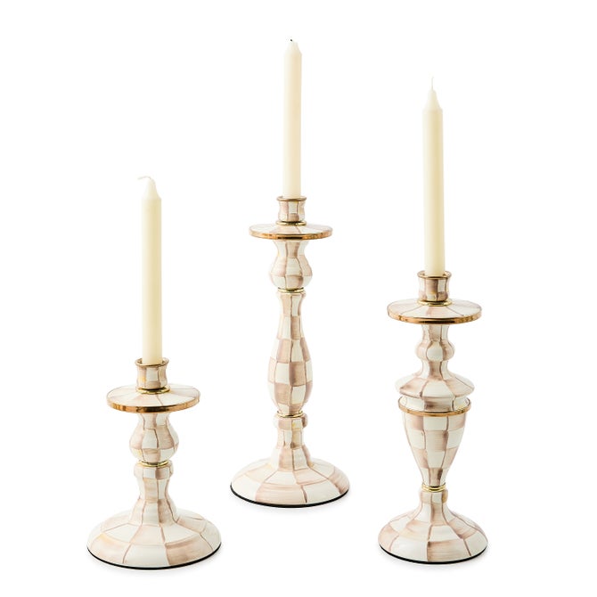 Hand-painted checkered enameled steel candlestick with bronzed stainless rim and brass accents.