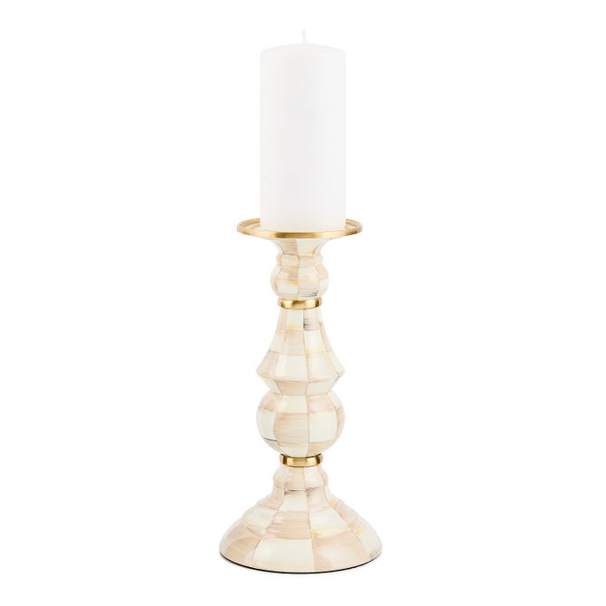 Hand-glazed steel pillar candlestick with painted check pattern, brass accents, and bronzed stainless steel rim.