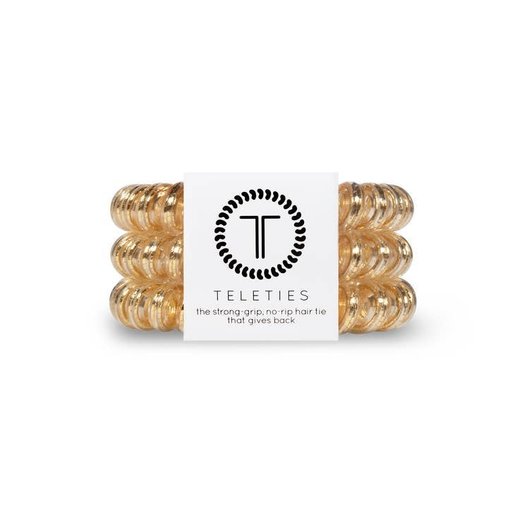 Good As Gold hair tie in large size with a metallic gold finish.