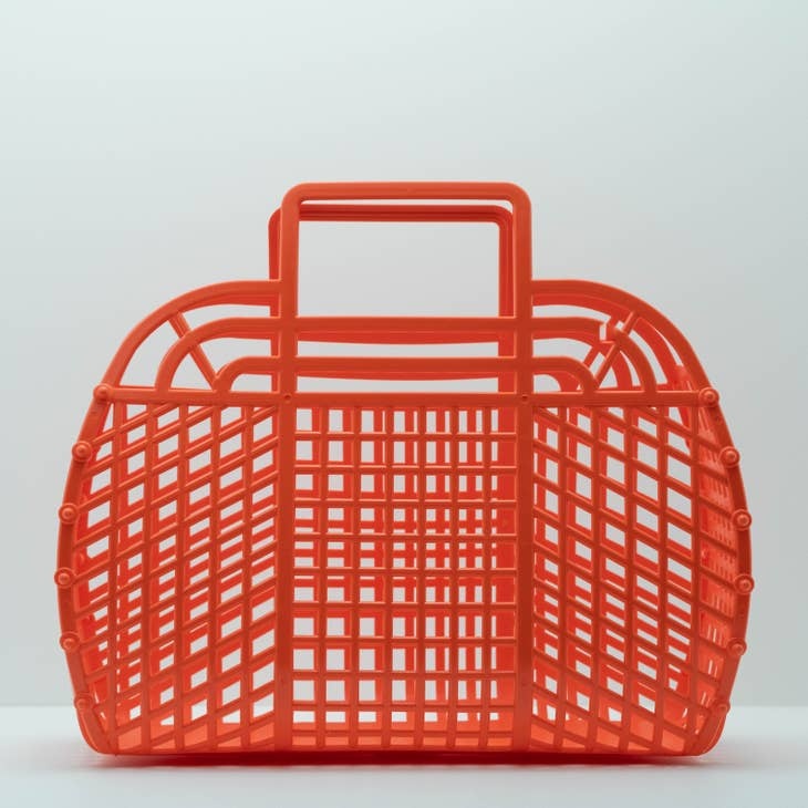 Large retro jelly basket in translucent blue with beadwork handles.