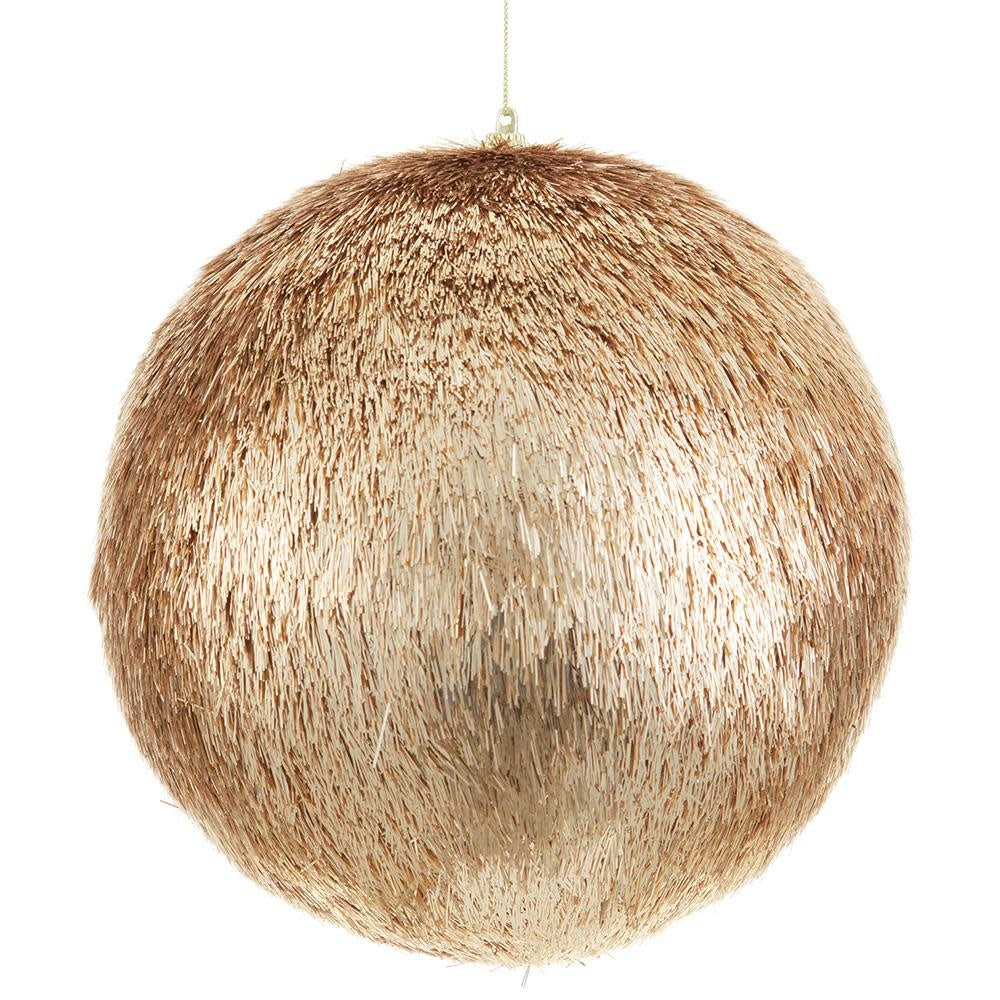 Eight-inch gold tinsel ball ornament with shimmering texture on a holiday tree branch.