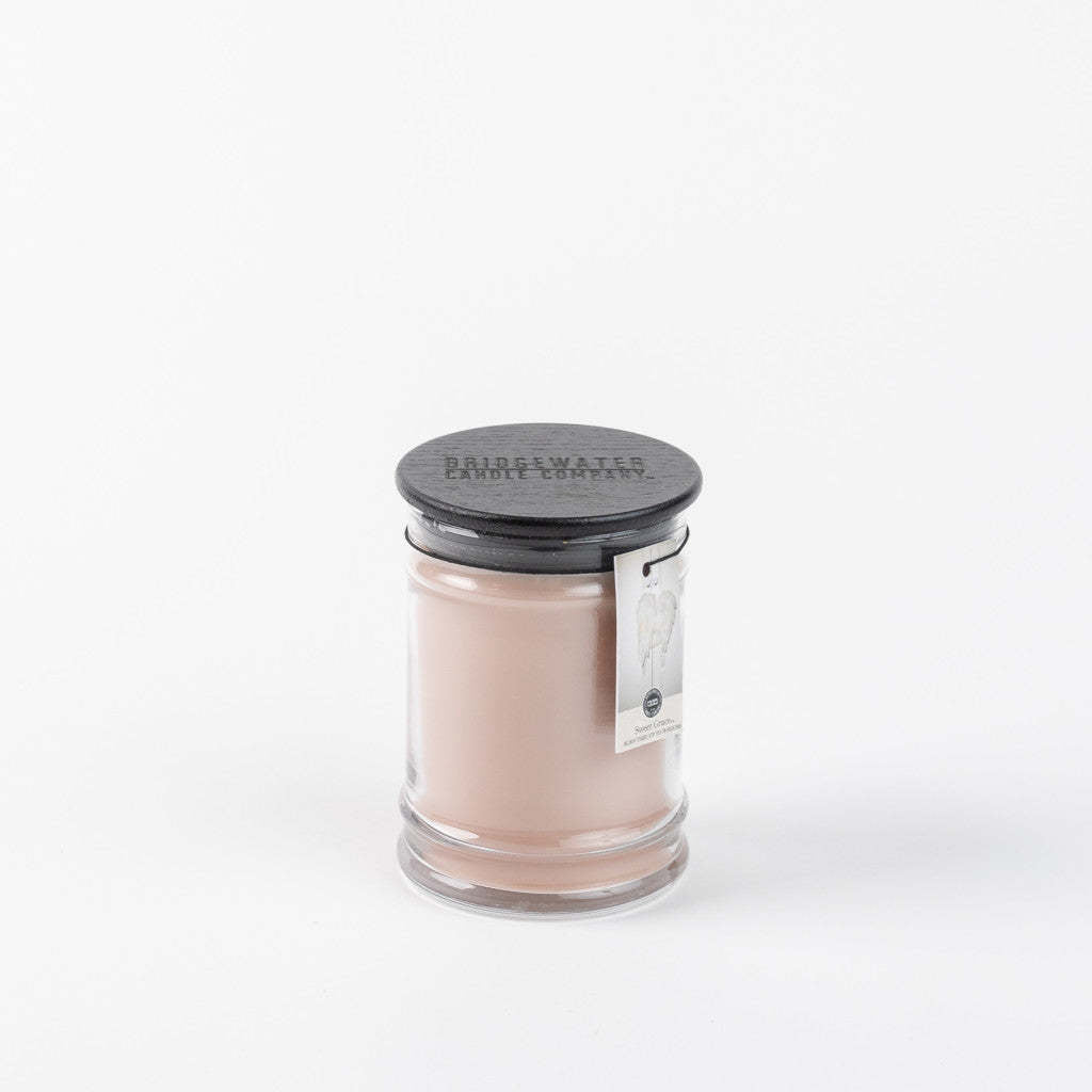 8oz glass jar candle with Sweet Grace fragrance featuring a warm amber hue.
