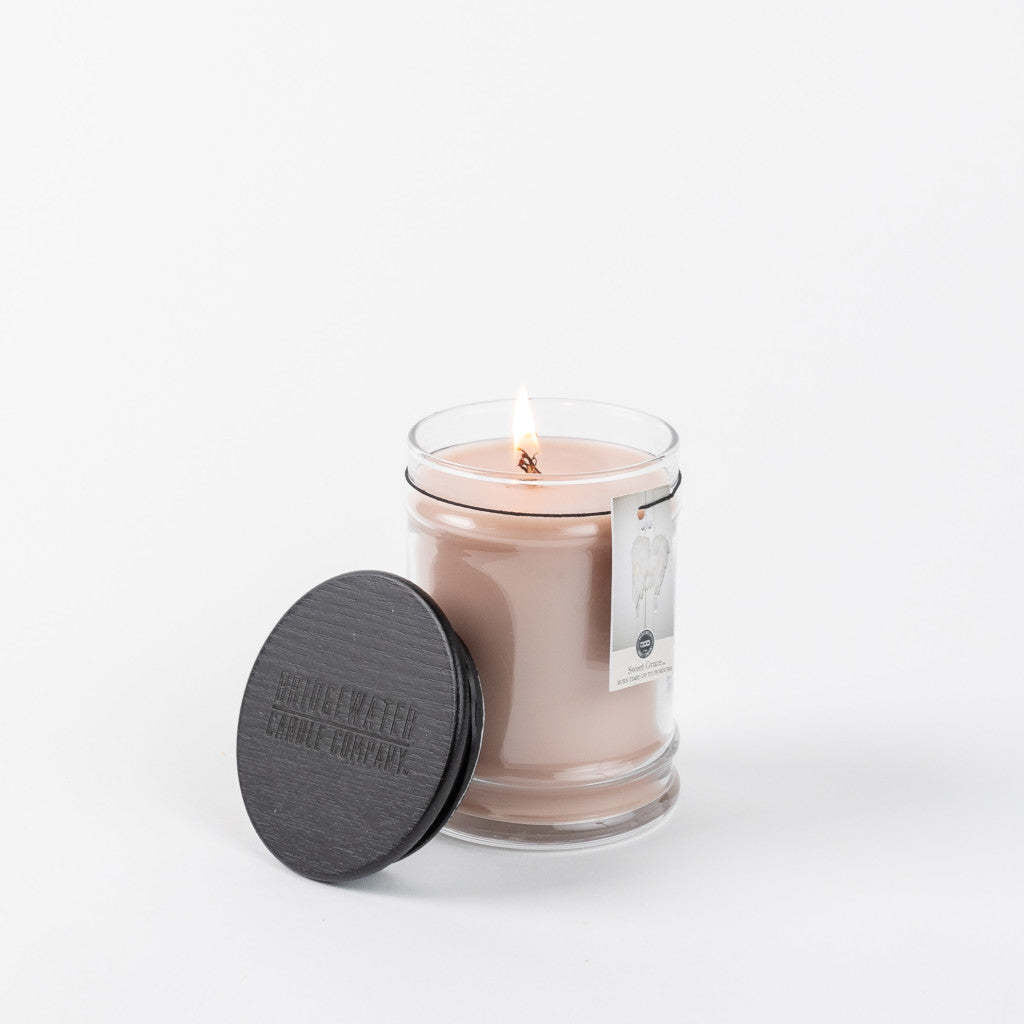 8oz glass jar candle with Sweet Grace fragrance featuring a warm amber hue.