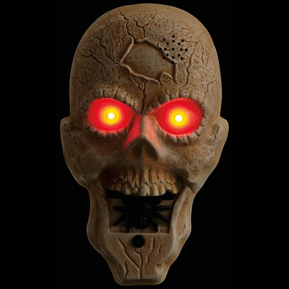 Beige antique battery-operated skull doorbell with light