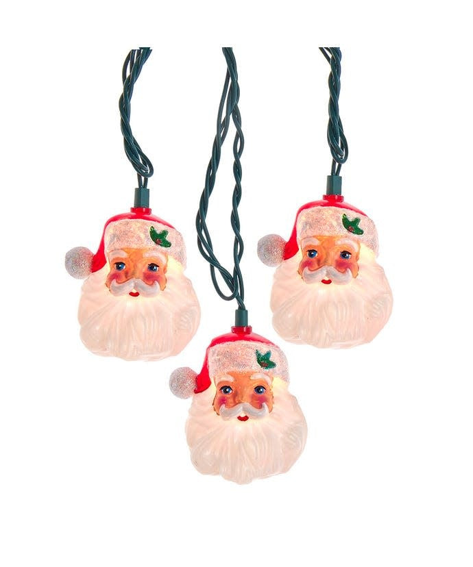 Multicolor incandescent Santa head light set with clear bulbs on a green wire.
