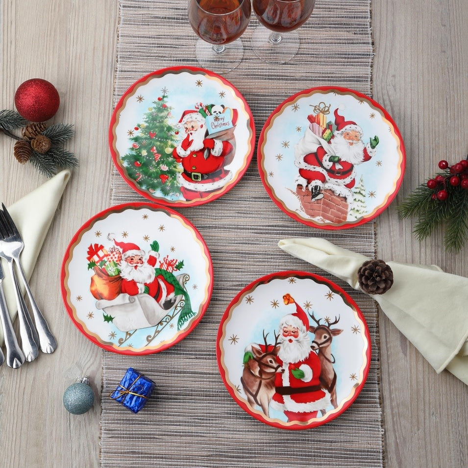 Ceramic Santa plate with gold foil scalloped trim on a glossy white background.