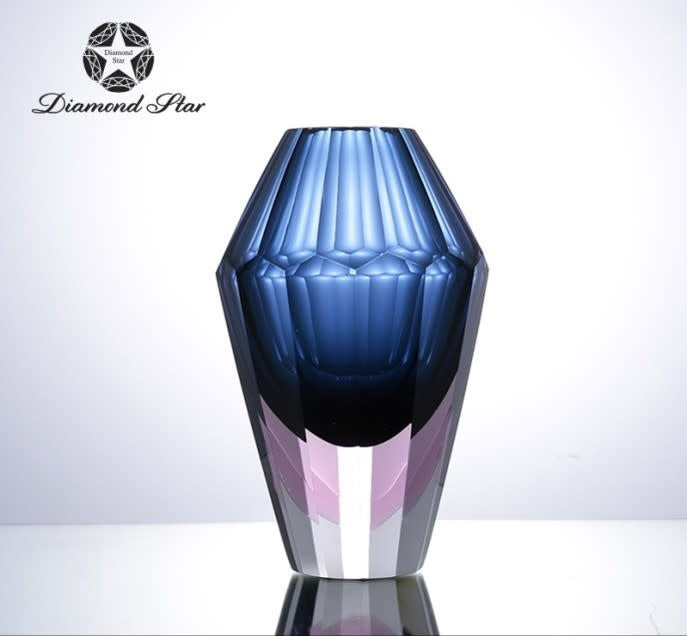 Clear glass vase with a cylindrical shape measuring 9.1 inches in height.