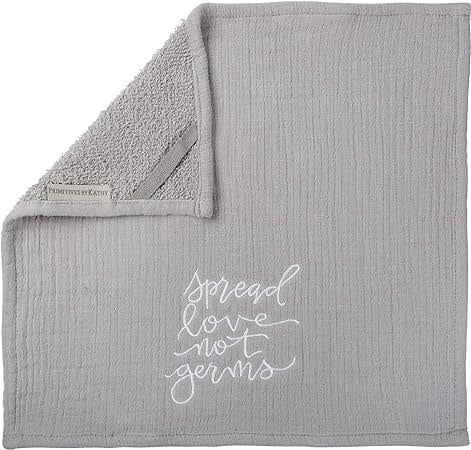 Folded two-ply cotton washcloth with embroidered 'Spread Love Not Germs' text on top layer and terry bottom.