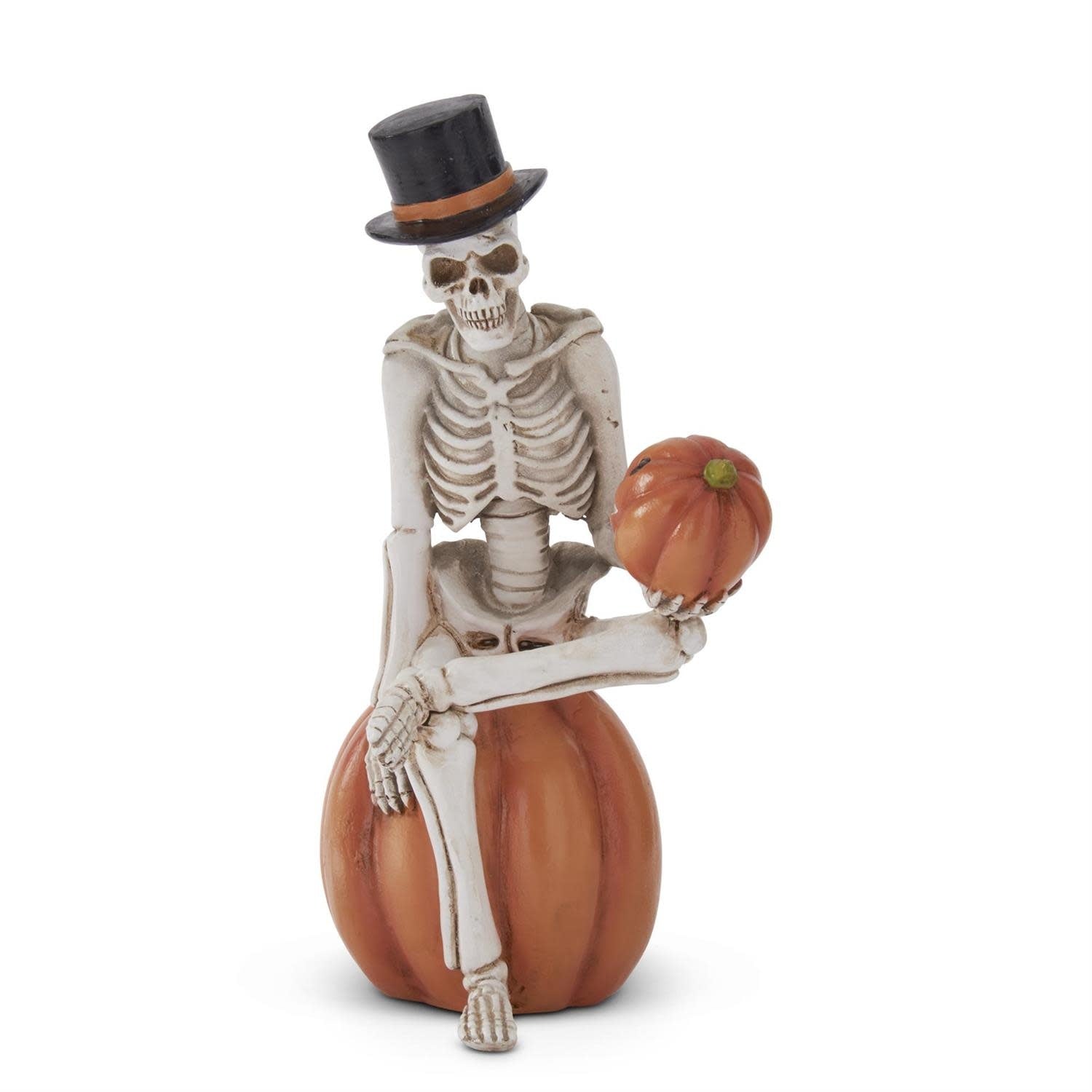 9.25-inch polyresin skeleton man figurine seated atop an orange pumpkin with detailed facial features.