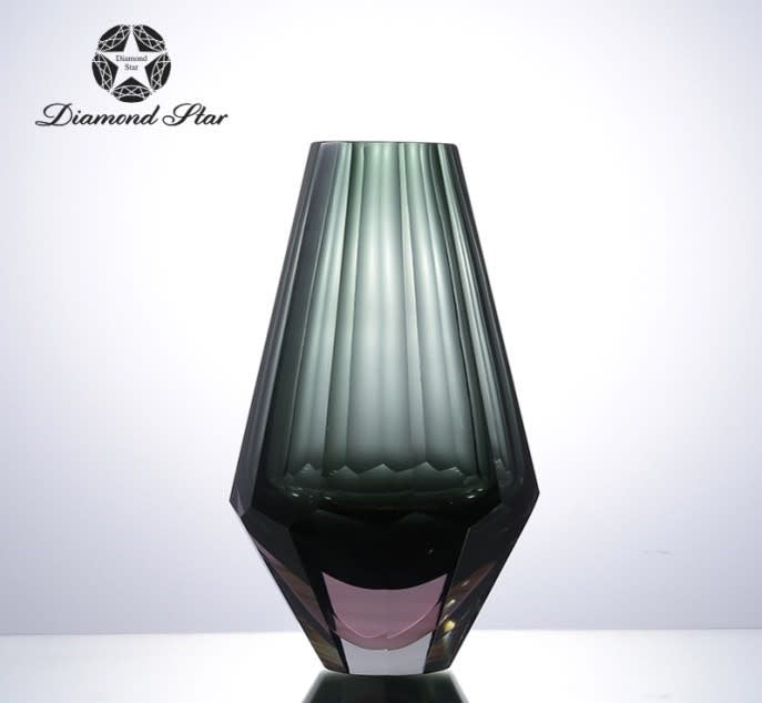 Clear glass vase with a square silhouette measuring approximately six inches wide.