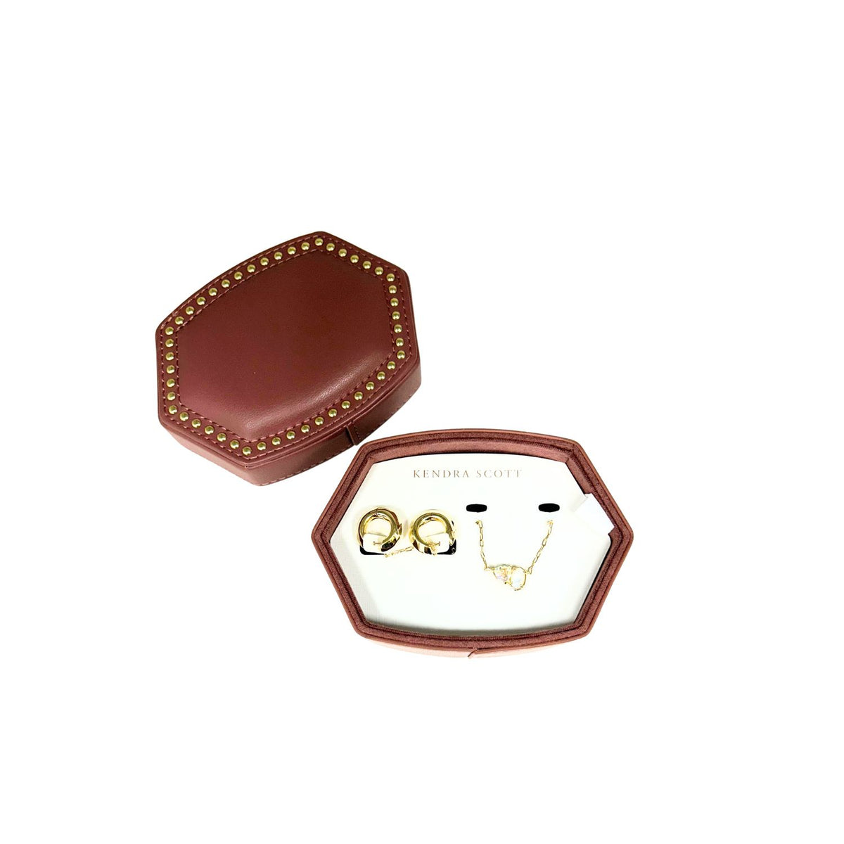 Kendra Scott Tatum necklace and Mikki huggie earrings in a studded burgundy jewelry box.