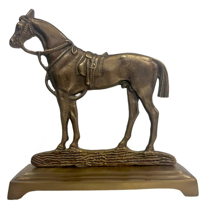Antiqued brass horse door stopper on a rectangular base featuring a saddled horse figurine.