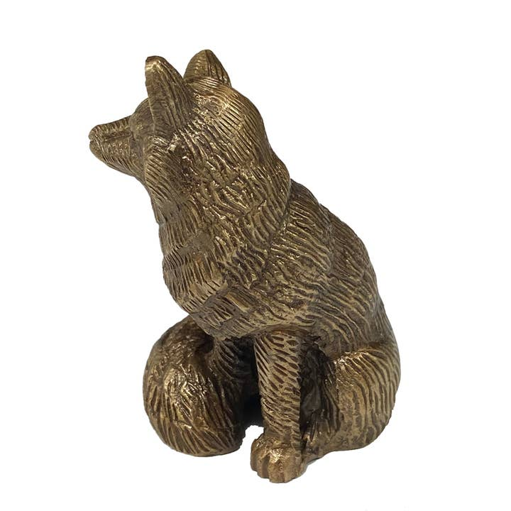 Antiqued solid brass sitting fox figurine with detailed etched fur texture on a white background.