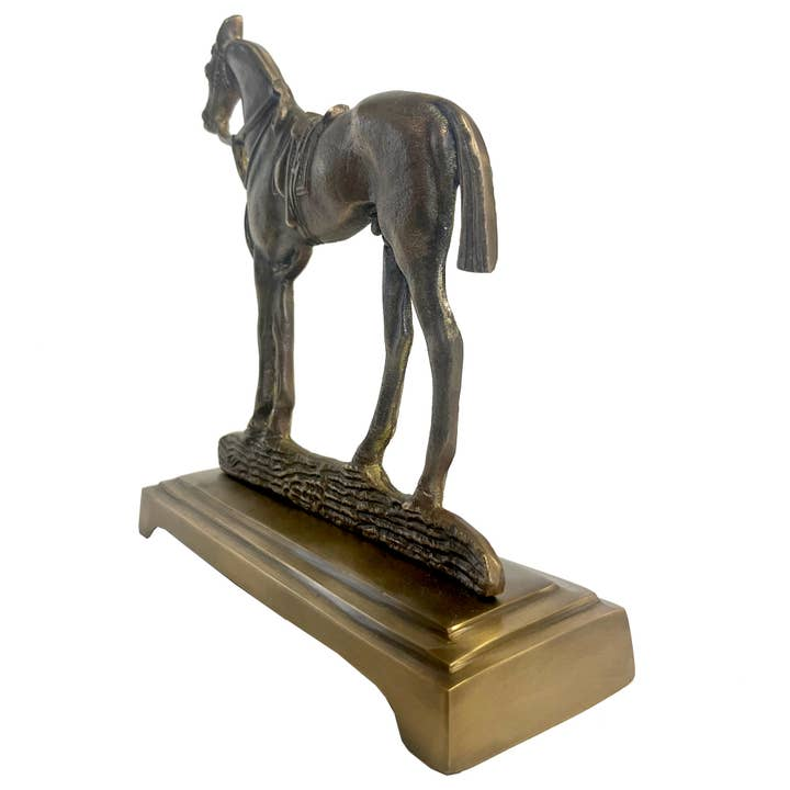 Antiqued brass horse door stopper featuring a detailed horse sculpture on a tiered rectangular base.