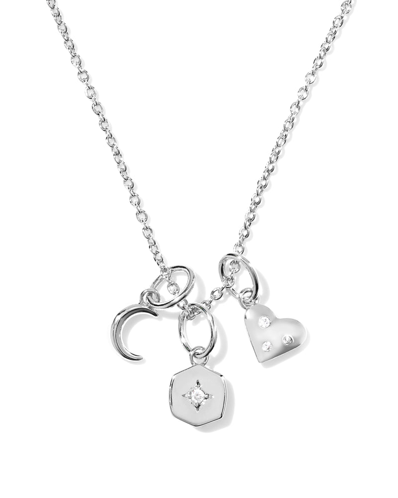 Silver Arlene Charm Necklace with crescent moon, star-set hexagon, and CZ-studded heart charms.