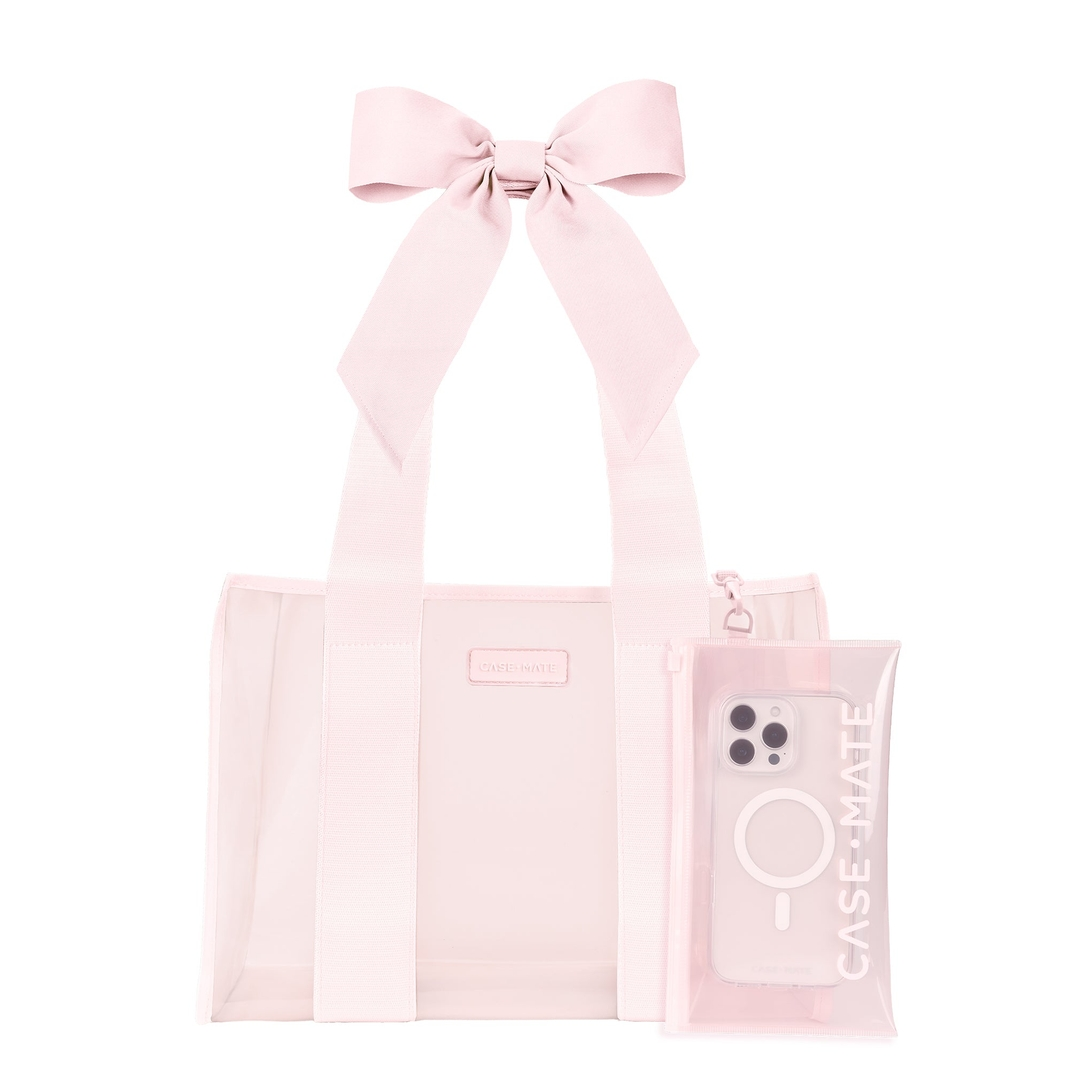 Light pink jelly tote bag with a large bow on the straps and a matching small zipper pouch.
