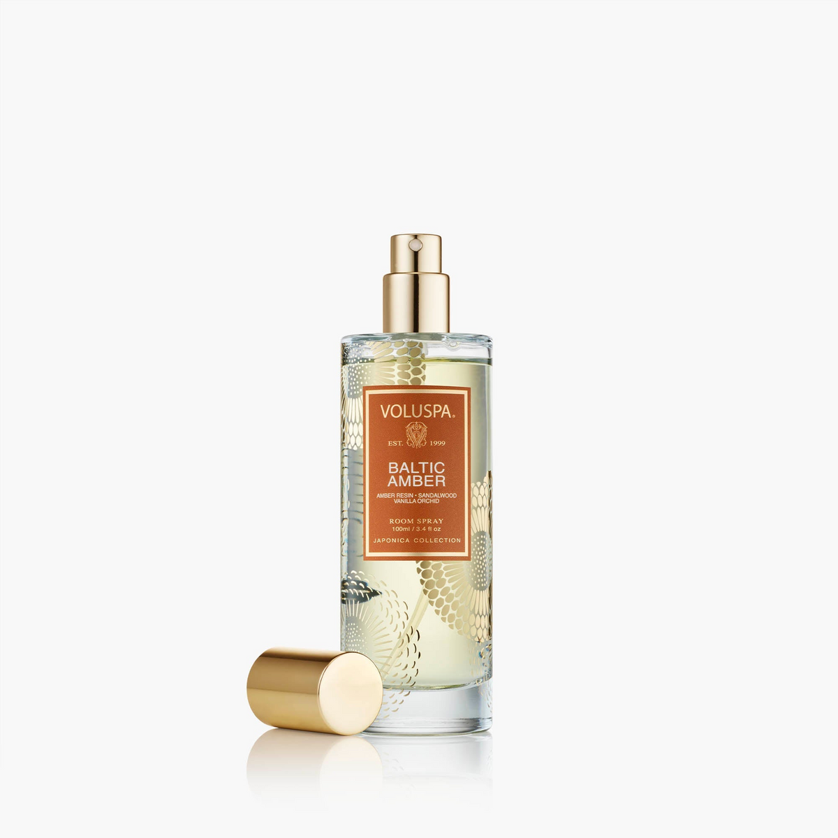 Voluspa Baltic Amber Room Spray in a 100ml glass bottle with gold accents and a separate gold cap.