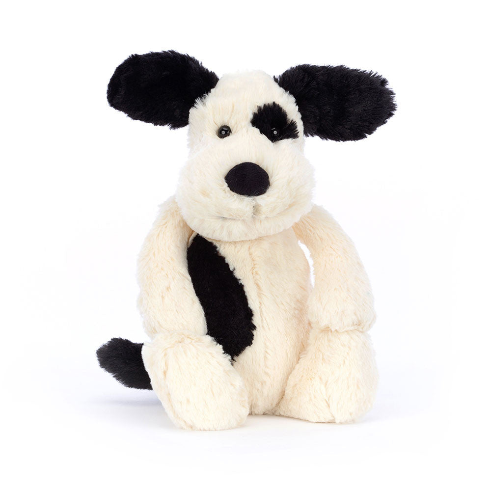 Bashful Black & Cream Puppy plush toy with a black eye patch, ears, and tail.