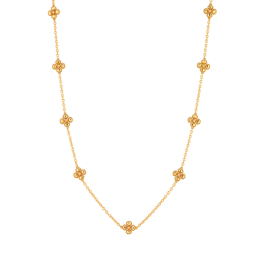 Gold 28-inch station-set chain necklace with nine textured clover motifs.