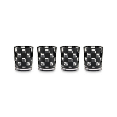Set of four black acrylic tumblers with a white checkered pattern.