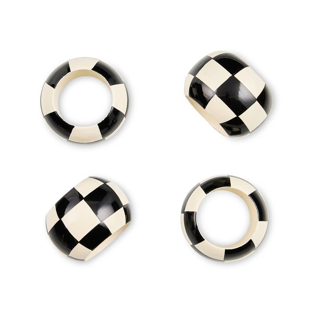 Set of four black and white checkered wood napkin rings with a square silhouette.