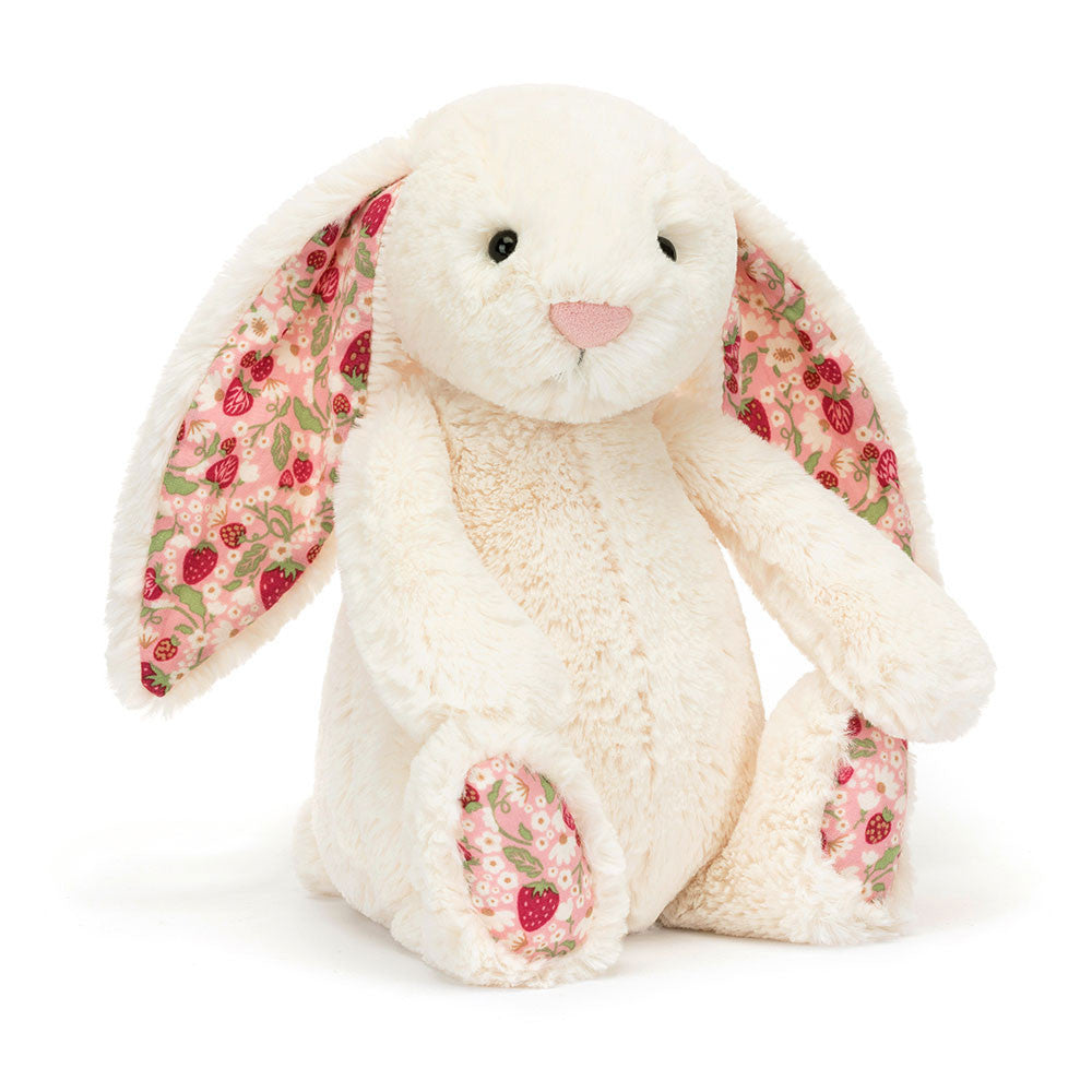 Cream bunny toy with berry-colored ears in a soft plush silhouette.