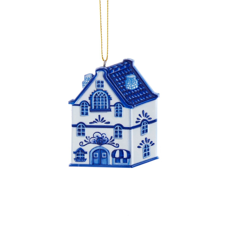 Blue and white resin townhouse ornament with a gold hanging string.