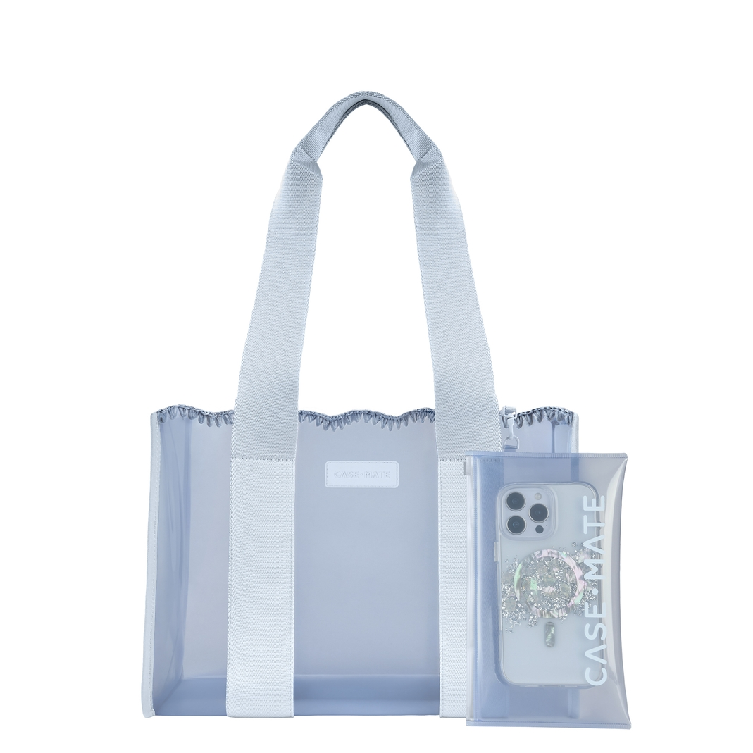Light blue semi-transparent jelly tote bag with wide jacquard straps and a matching zipper pouch.