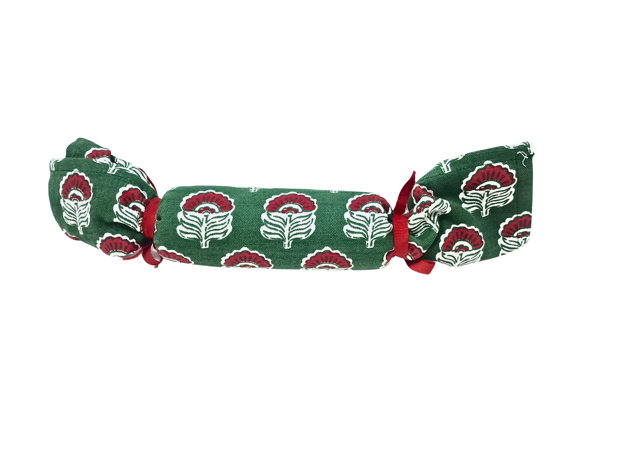 Green Christmas block print towel rolled and tied with red ribbons in a cracker shape.