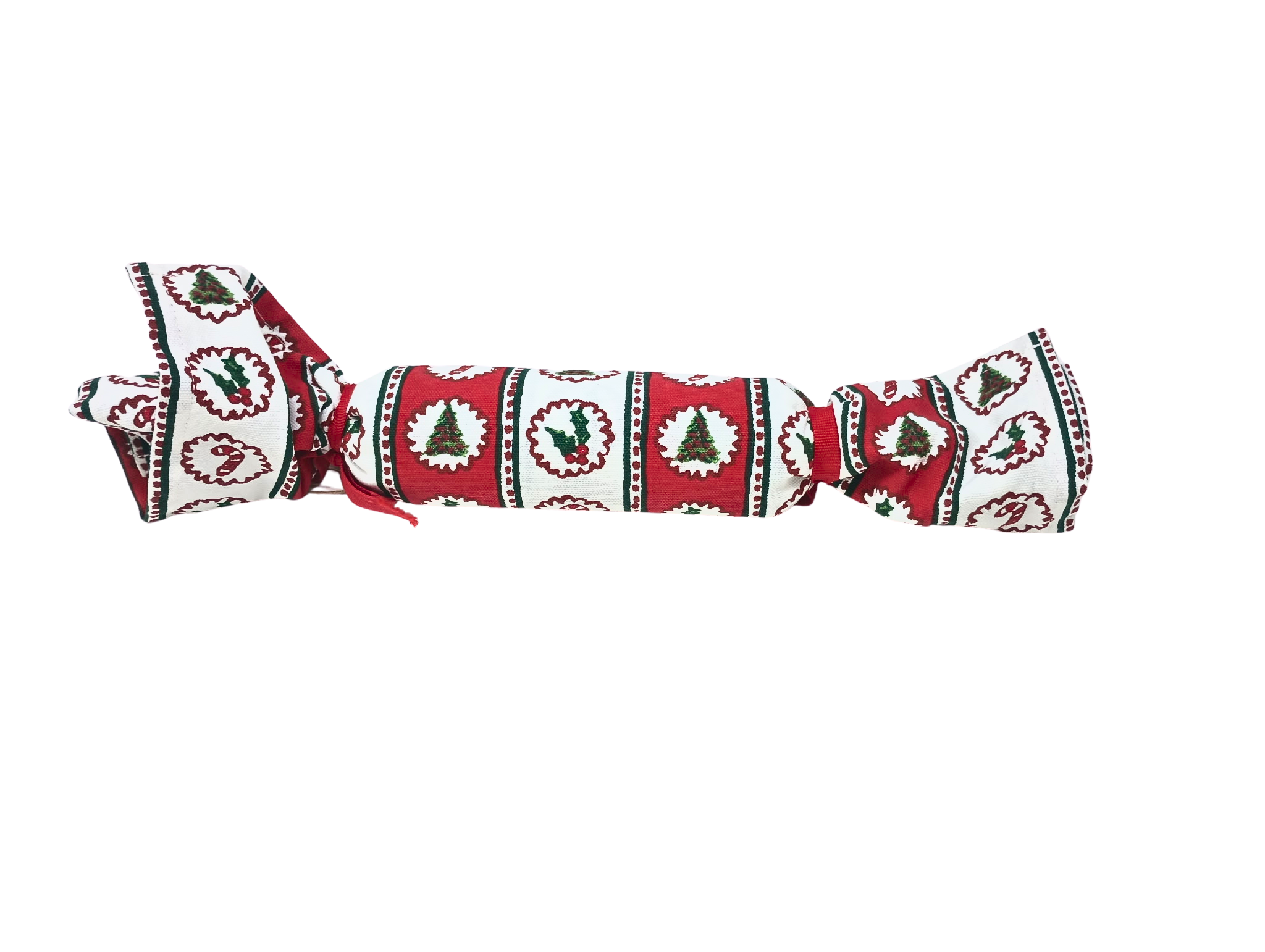 Christmas block print towel rolled and tied with red ribbon, featuring holly and tree patterns.