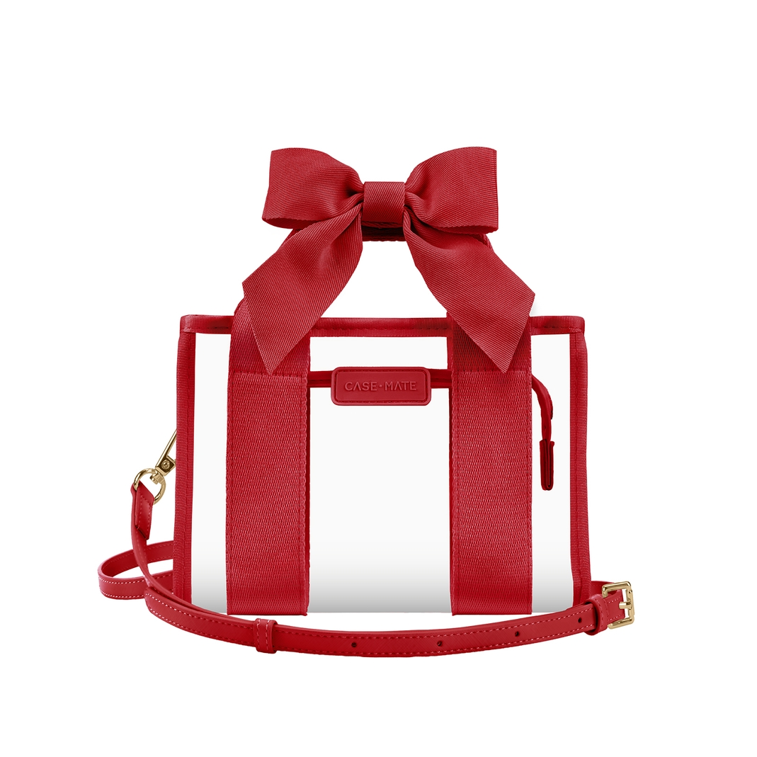 Clear jelly stadium bag with red bow handles, red trim, and an adjustable crossbody strap.