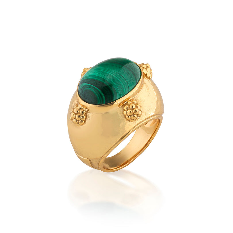 Cleopatra gold-plated brass ring featuring an oval malachite gemstone and four berry accents.