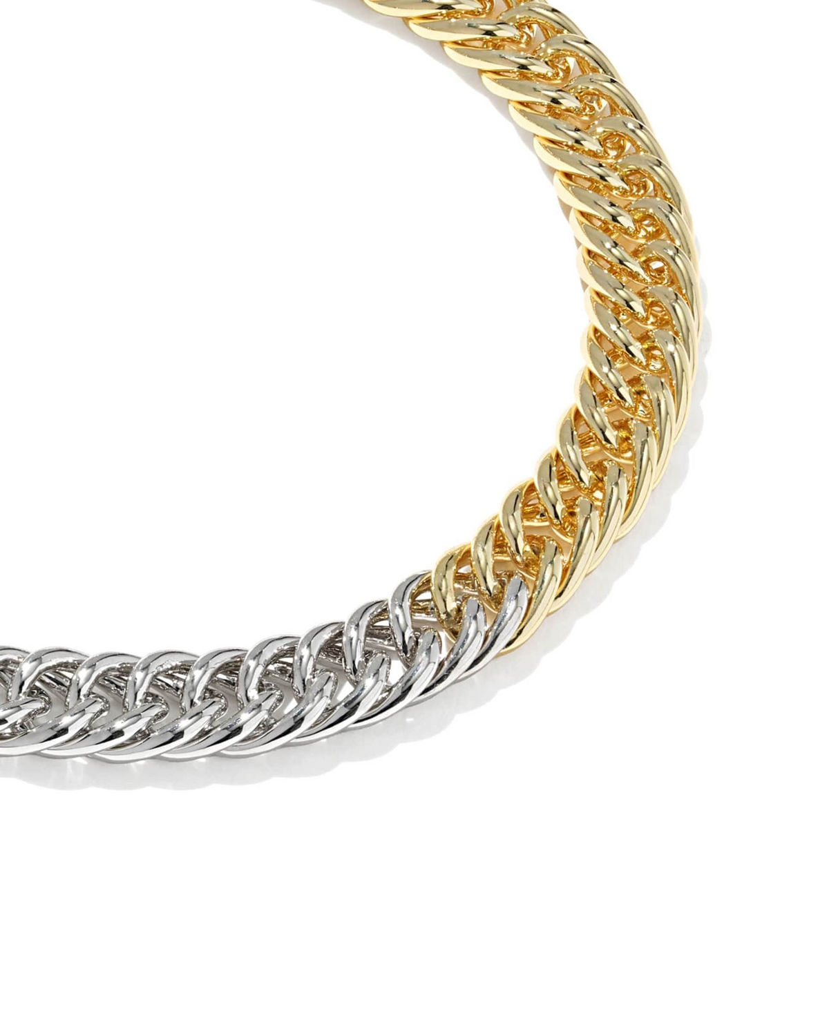 Close-up of the Colette Chain Bracelet featuring interlocking gold and silver curb chain links.