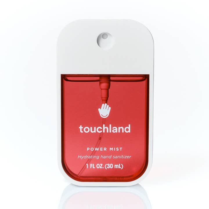 Touchland Cranberry Fizz Power Mist hand sanitizer in a white rectangular spray bottle with red liquid