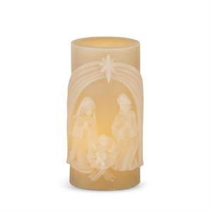 Cream LED pillar candle featuring a carved nativity scene with Mary, Joseph, and baby Jesus.