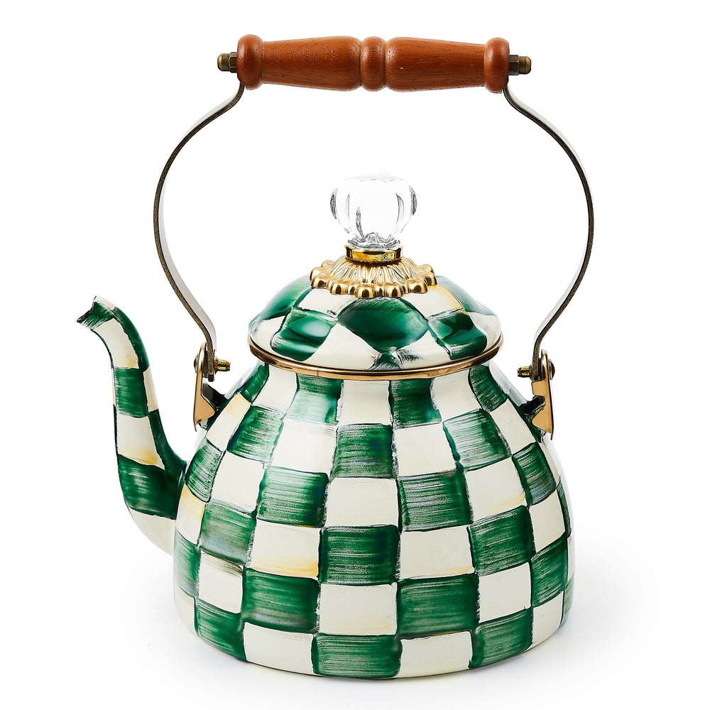 Emerald and white checkered enamel tea kettle with a wooden handle and glass lid knob.