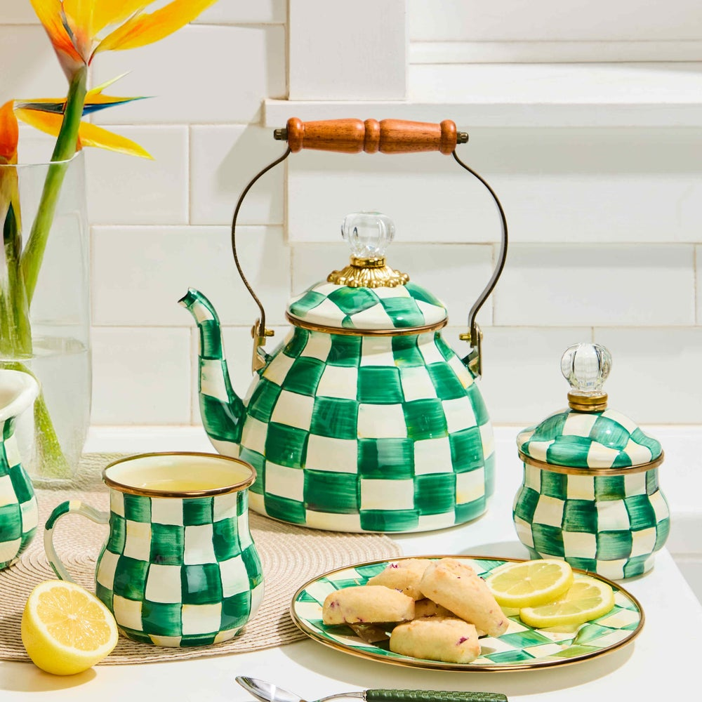 Emerald Check 2 Quart Tea Kettle with matching mug, sugar bowl, and plate on a white counter.