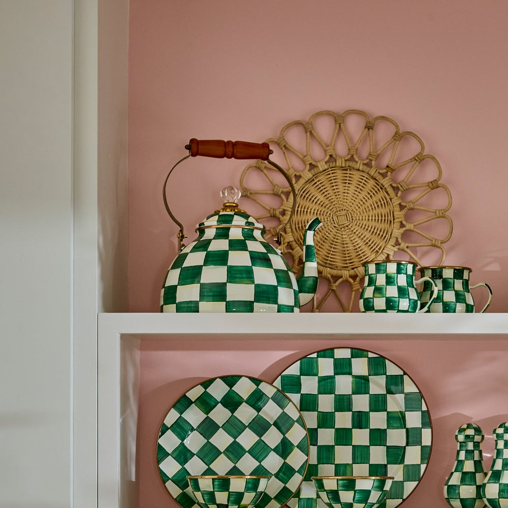 Emerald Check Enamel 3 Quart Tea Kettle with hand-painted green checks and a wood handle on a shelf.