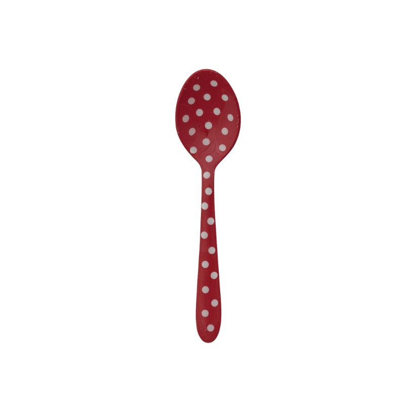 Red enameled stainless steel spoon with white polka dots on a white background.