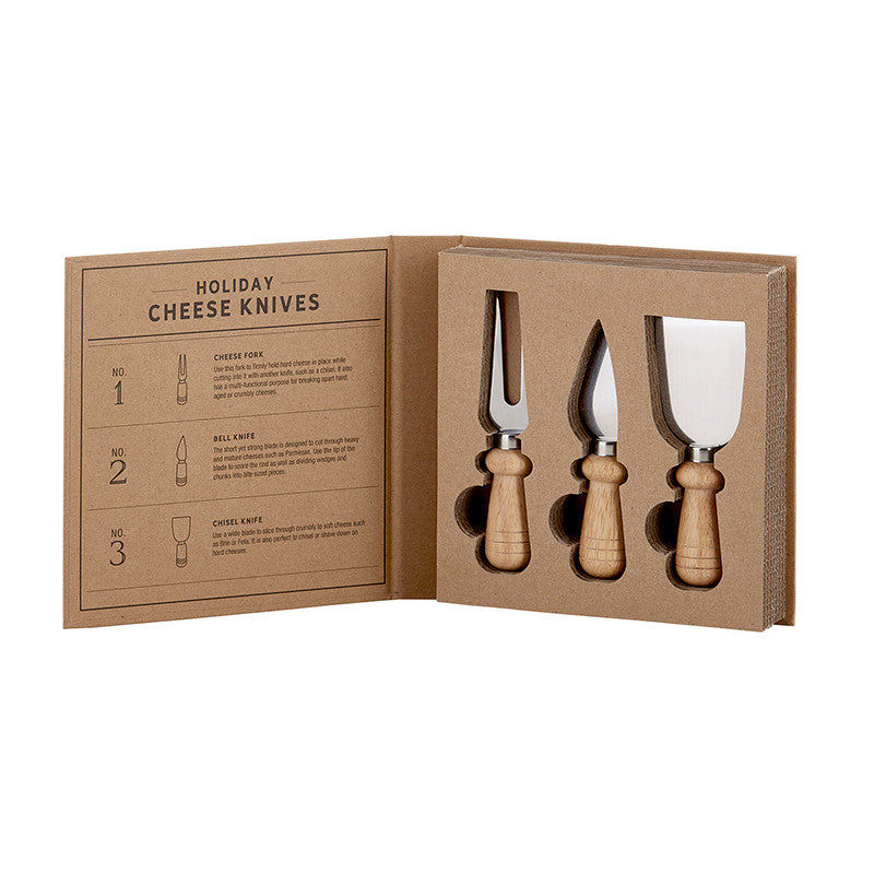 Holiday Cheese Knives Book Box set featuring a cheese fork, bell knife, and chisel knife.
