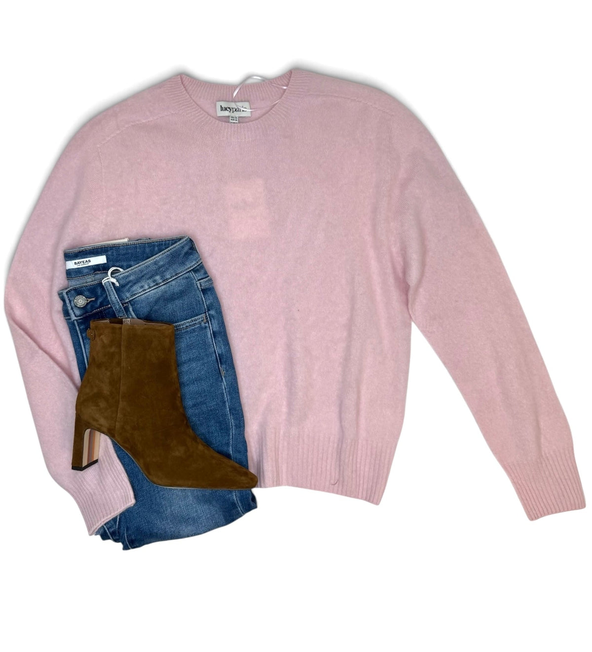 Pink Tracy Relaxed Sweater by Lucy Paris paired with blue jeans and brown suede ankle boots.